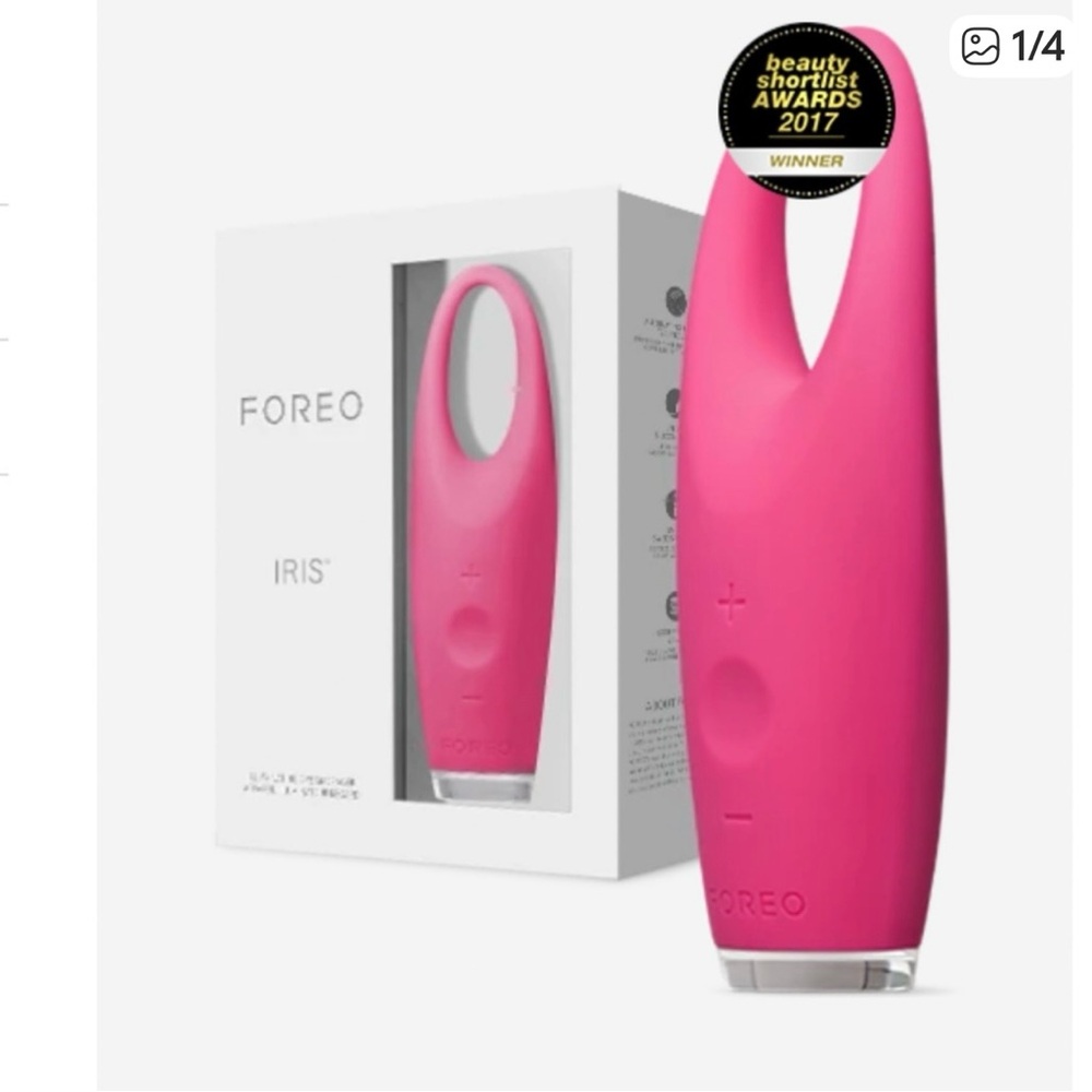 FOREO pink eye massager with USB charger and cards